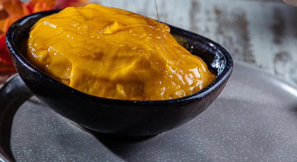 Golden mango preparation in a simple bowl